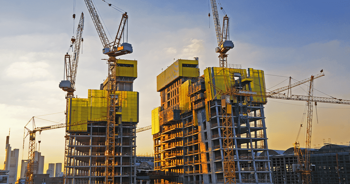 Engineers reviewing plans on an active site
