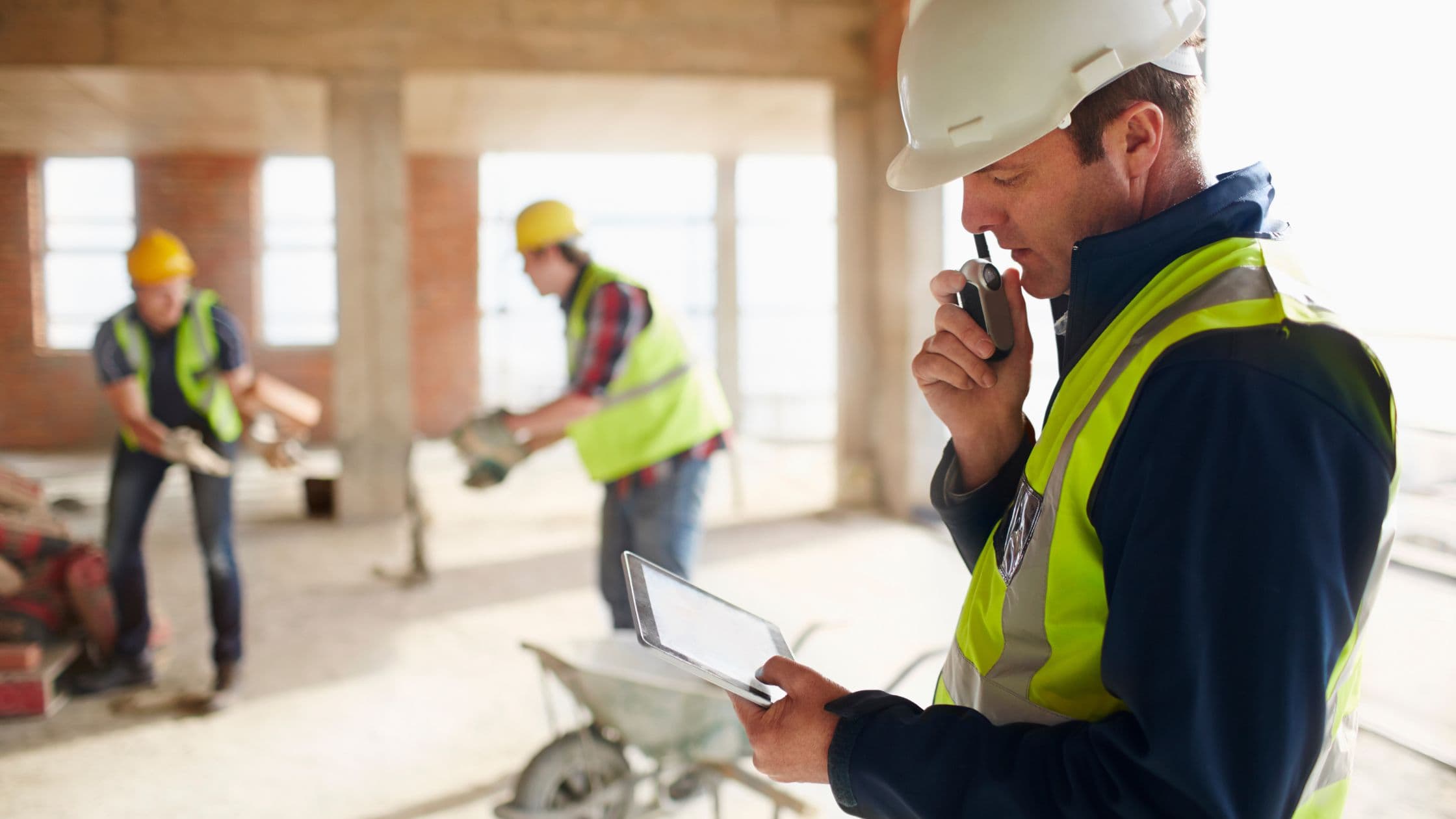Safety officer inspecting a site with a checklist
